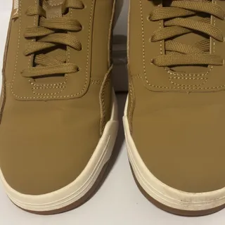 Photo of Puma men’s low top size 9 khaki color