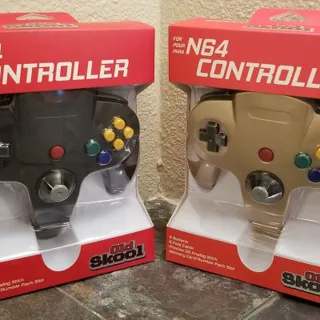 Photo of 2 N64 Controllers - Gold & Black (NEW) - Nintendo64