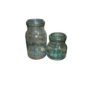 Photo of 2 aqua Atlas Ez Seal Jars missing bails 1 qt 1 squat pint Big one marked 5 on bottom Both Have rim chips but over all in good shape