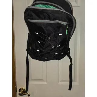Photo of HP Black backpack with green lining