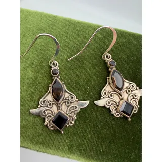 Photo of sterling silver dangle earrings intricate scrollwork and faceted smoky quartz