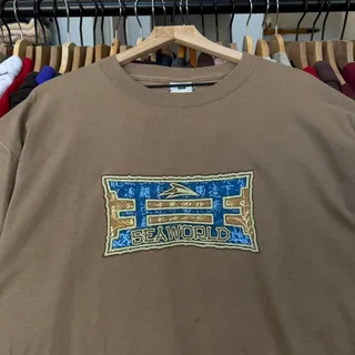 Photo of Vintage 90s Sea World Promo Shirt in Light Brown With Cool Western Style Graphic