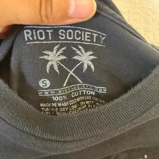 Photo of Riot society black tee snoppy size small