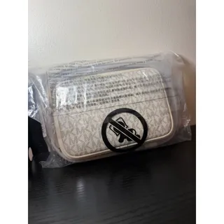 Photo of #051 - Lt Cream Jet Set Travel Small Signature Logo Camera Crossbody Bag