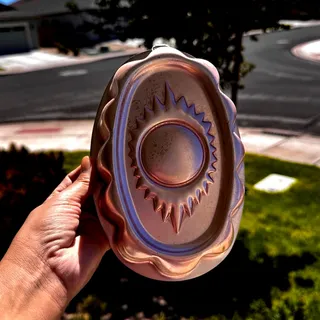Photo of copper-tone aluminum oval sunburst jello mold or kitchen wall decor vintage