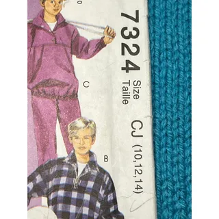 Photo of McCalls 7324 Sewing pattern Kids sweatsuit pullover quarter zip pants hoodie size 10 12 14