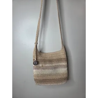 Photo of The Sak Crossbody Multi Colored Crochet Handbag Purse with bag charm