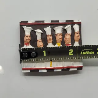 Photo of 3D Italian or French chefs posing alongside a rooster 2.25” x 2.25” approx.