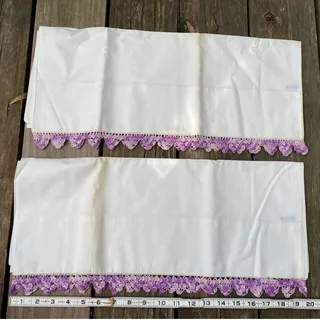Photo of pillow case pair with crocheted trim purple