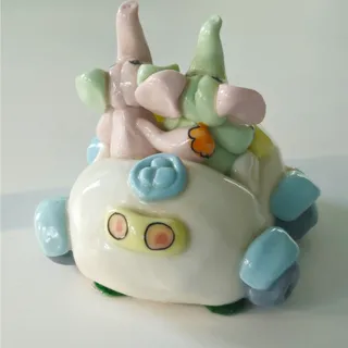 Photo of Vintage Miniature Ceramic Elephants in Benz Car | 1990s Whimsical Pastel Kitsch