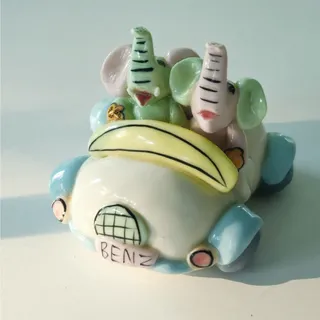 Photo of Vintage Miniature Ceramic Elephants in Benz Car | 1990s Whimsical Pastel Kitsch