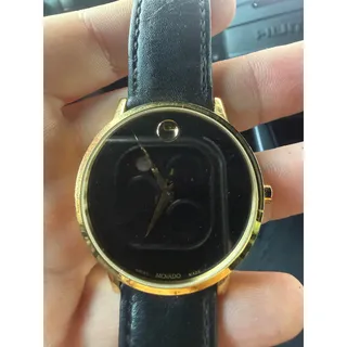 Photo of Leather black and gold movado watch