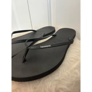 Photo of Black Havaianas You Metallic flip-flops signature slim rubber straps women’s 11/12