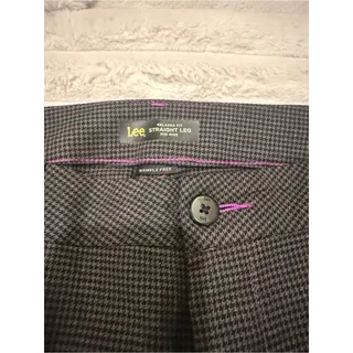 Photo of Lee Women’s brown and black houndstooth straight leg mid rise trousers.