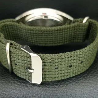 Photo of Vintage 1977 HMT Manual Wound Mens Silver Watch & Green accents
