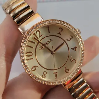 Photo of Vintage Geneva Womens Watch Gold Tone 38mm Champagne Dial Gemmed Quartz Bracelet