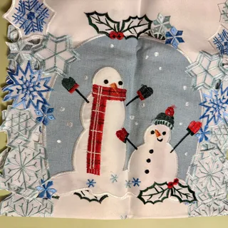 Photo of Embroidered Linen Snowman with Blue Snowflakes Christmas Table Runner